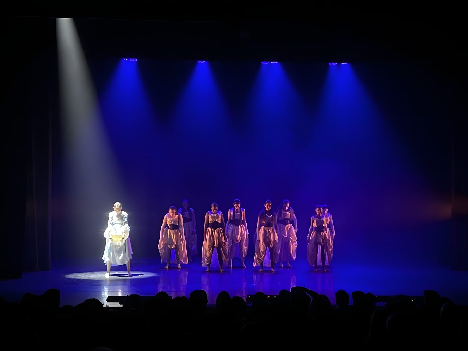 A World of Dance - Blue solo with the ensemble in shadow